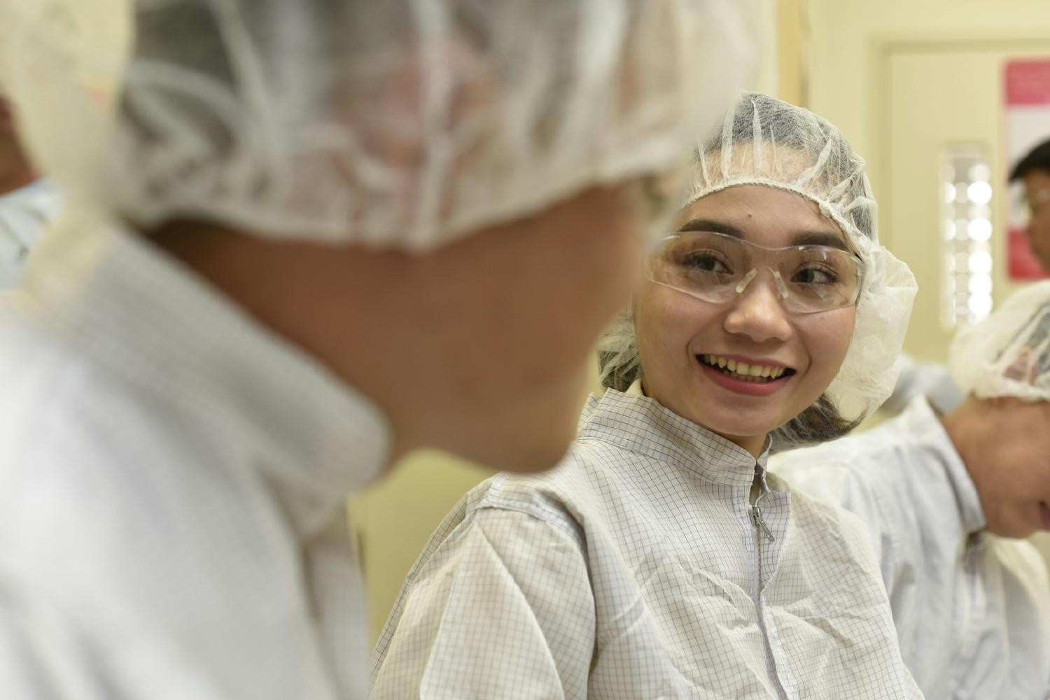 Intel employees preparing to enter an Intel fabrication plant.