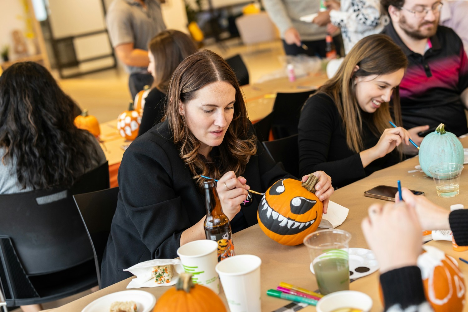 Colleagues displayed their creativity in our Pumpkinpalooza painting contest, which included cider and fall treats.