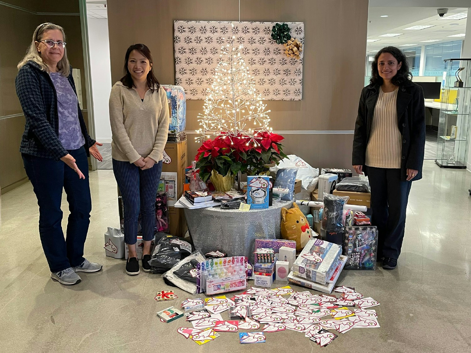 Collection of holiday gifts for Casa Pacifica's Make a Wish Come True event for children in need
