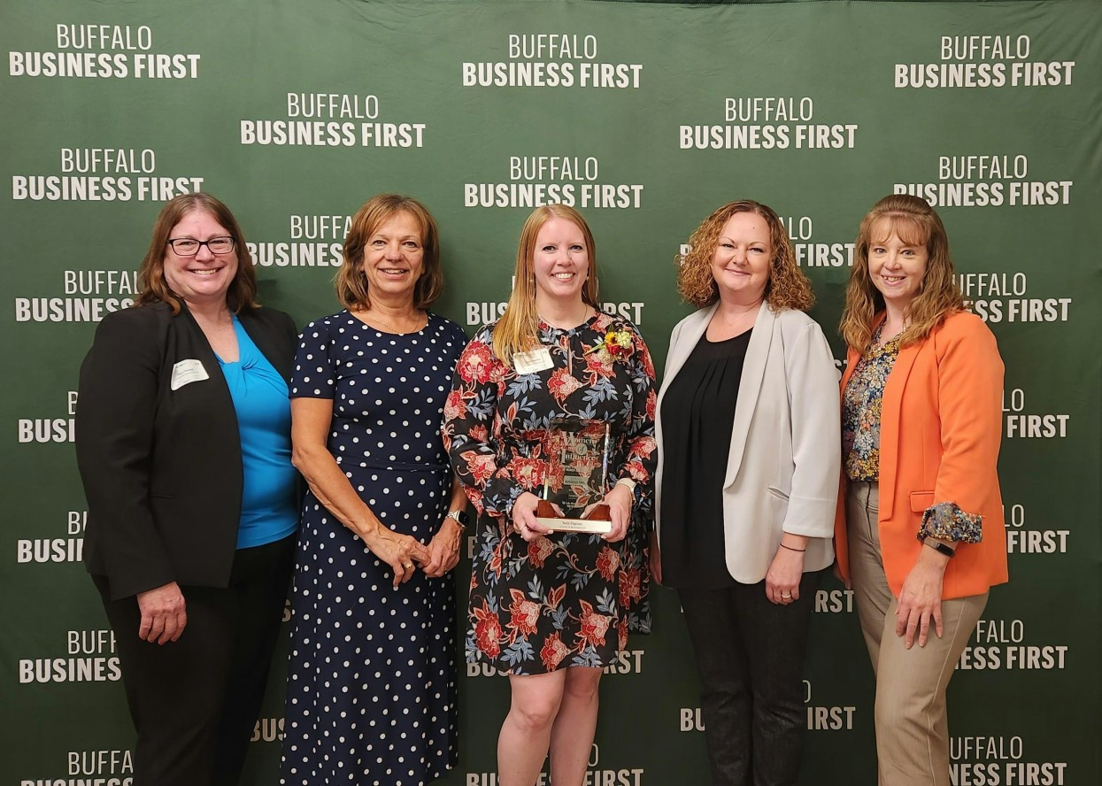 Managing Partner, Sara Dayton (center) receiving the 2023 Women of Influence award - Buffalo Business First. 